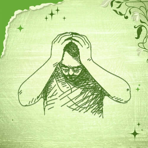 a man holding his head with his hands